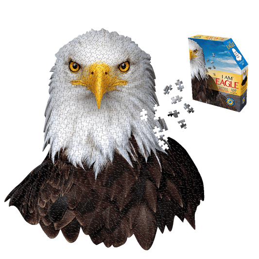 Madd Capp I AM EAGLE 550-piece jigsaw puzzle shown assembled as eagle head with white and yellow face and dark brown body, with loose puzzle pieces and blue pro