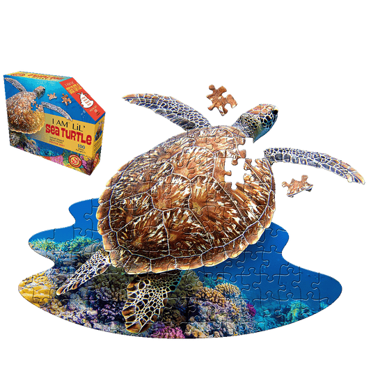 I AM LiL' Sea Turtle 100-piece jigsaw puzzle featuring sea turtle-shaped pieces with ocean and coral reef imagery, shown assembled and partially disassembled wi