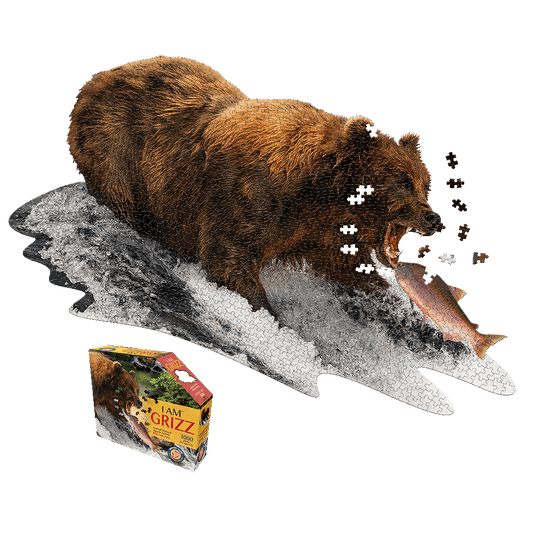 I AM GRIZZ 1000-piece jigsaw puzzle showing a brown grizzly bear catching a salmon, with scattered puzzle pieces and product box displayed