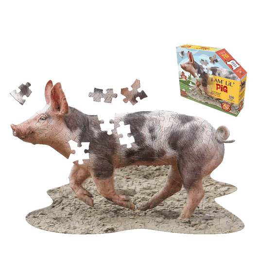 I AM LiL' Pig 100-piece jigsaw puzzle shaped like a pig standing in mud, shown assembled with loose pieces and box