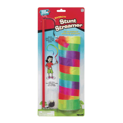 Rainbow Stunt Streamer packaged on red cardstock showing colorful rainbow-striped ribbon streamer with black control handle and cartoon child illustration