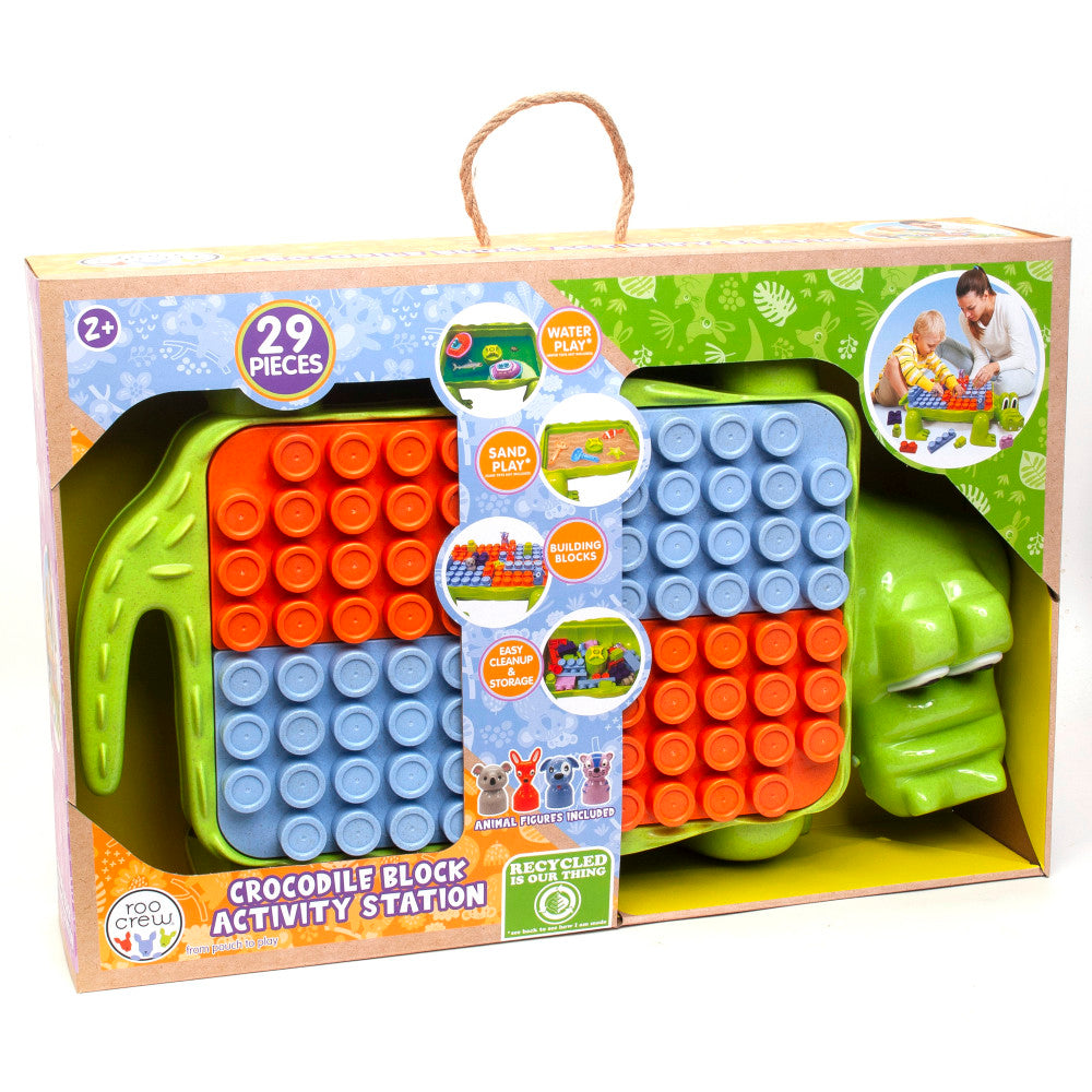 Crocodile Block Activity Station with bright green crocodile-shaped storage bin, red and blue building blocks, and animal figures, ages 2+