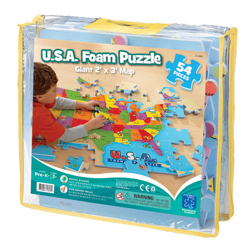 U.S.A. Foam Puzzle Giant 2' x 3' Map, 54 pieces, modeled by a child placing colorful state pieces on wooden floor