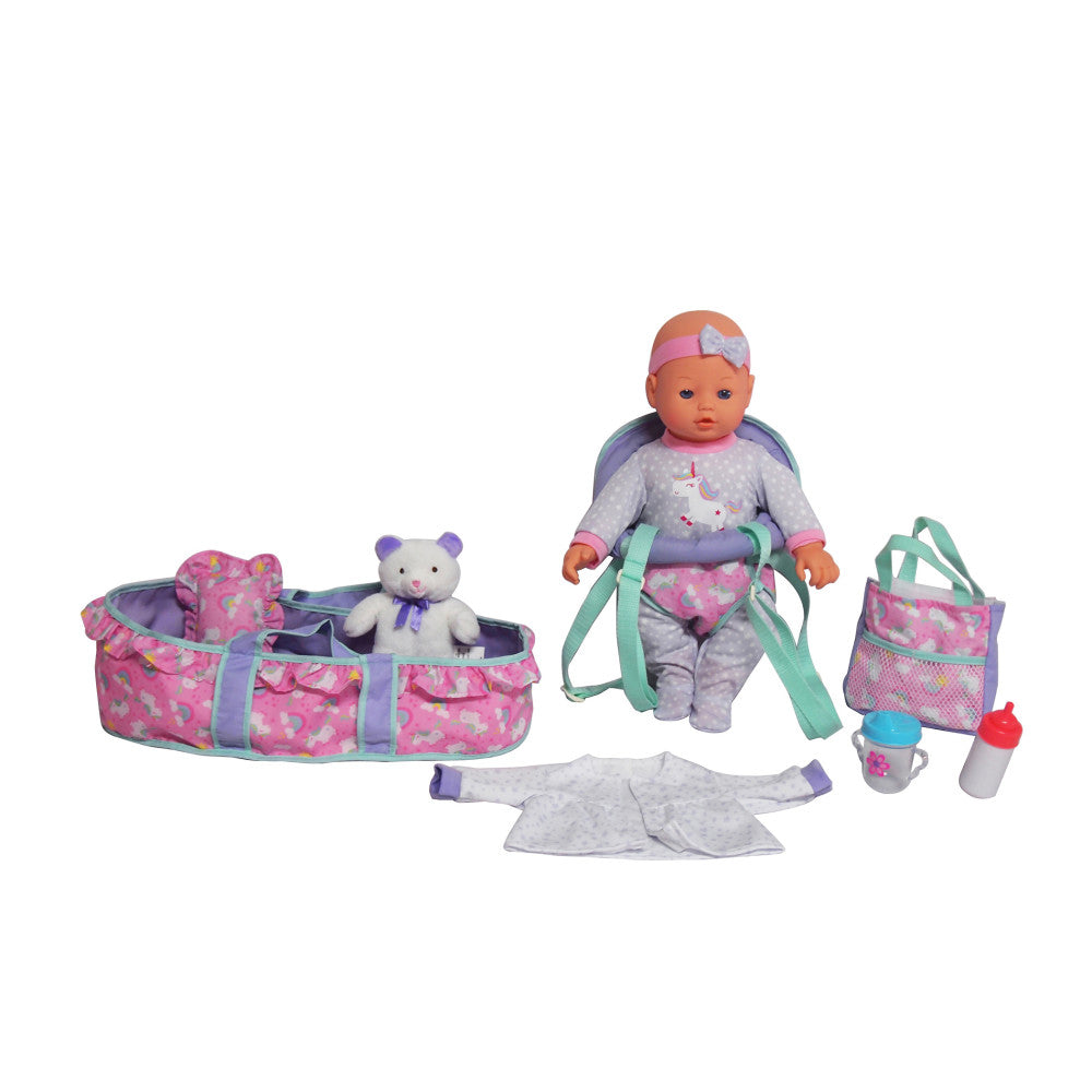Dream Collection 16" baby doll with pink headband and unicorn-themed outfit, surrounded by accessories including pink patterned carrier, white plush bear, green