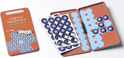 Magnetic Peg Solitaire game in orange tin case, showing closed lid with box art and open playing boards with blue and light blue magnetic pegs