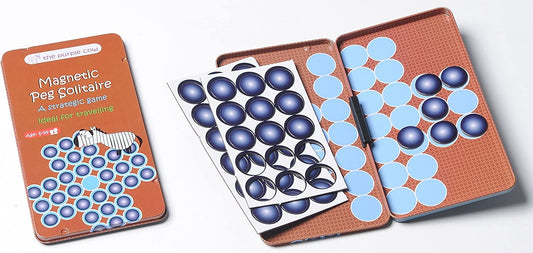 Magnetic Peg Solitaire game in orange tin case, showing closed lid with box art and open playing boards with blue and light blue magnetic pegs