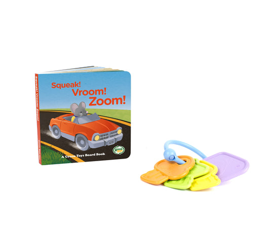 Squeak! Vroom! Zoom! board book with mouse in orange car, paired with colorful teething keys in yellow, green, orange, and purple with blue handle