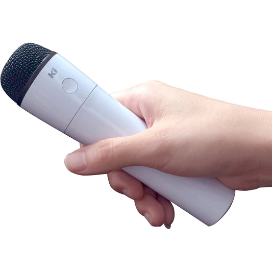 White and navy wireless microphone with textured grille, held in a child's hand on model