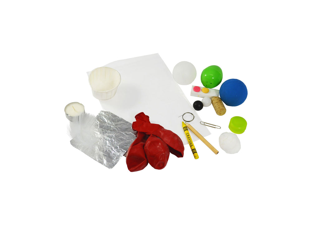 STEAM learning kit contents including red boxing gloves, colorful balls, aluminum foil, wooden sticks, crayon, metal ring, and small objects for sink-or-float e