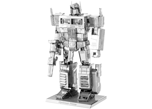 Metallic silver Optimus Prime robot figure assembled from metal sheet model kit, standing on base with horns and panel details visible