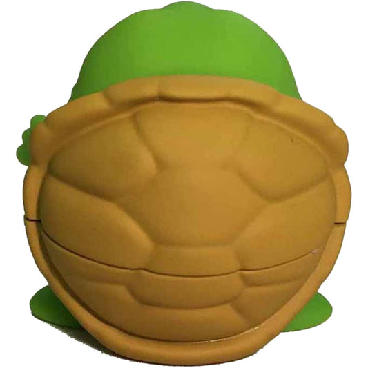 Turtle-shaped lip balm with green shell and tan face, scented lemon meringue