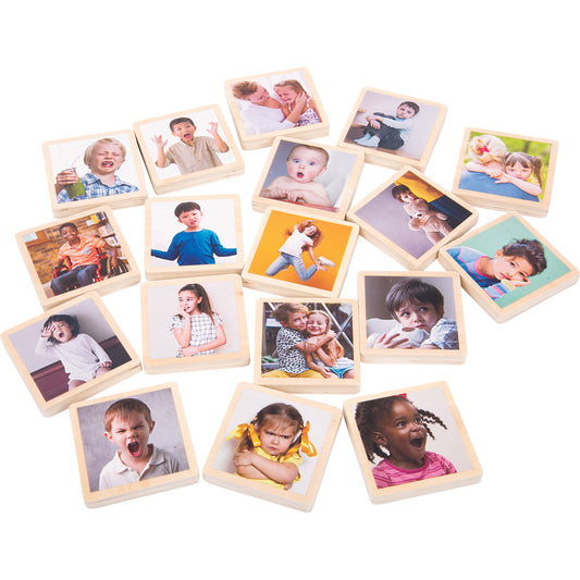 Set of 18 wooden tiles with natural frames, each featuring photographs of children displaying different emotions and expressions