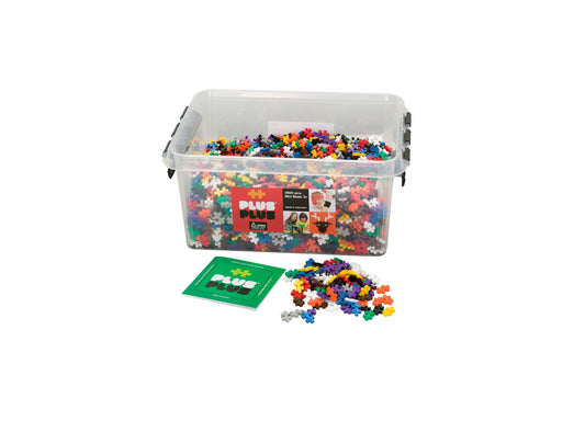 Plus-Plus 3600-piece building set in clear plastic storage container with lid and handles, including green instruction card and loose colorful plastic pieces in