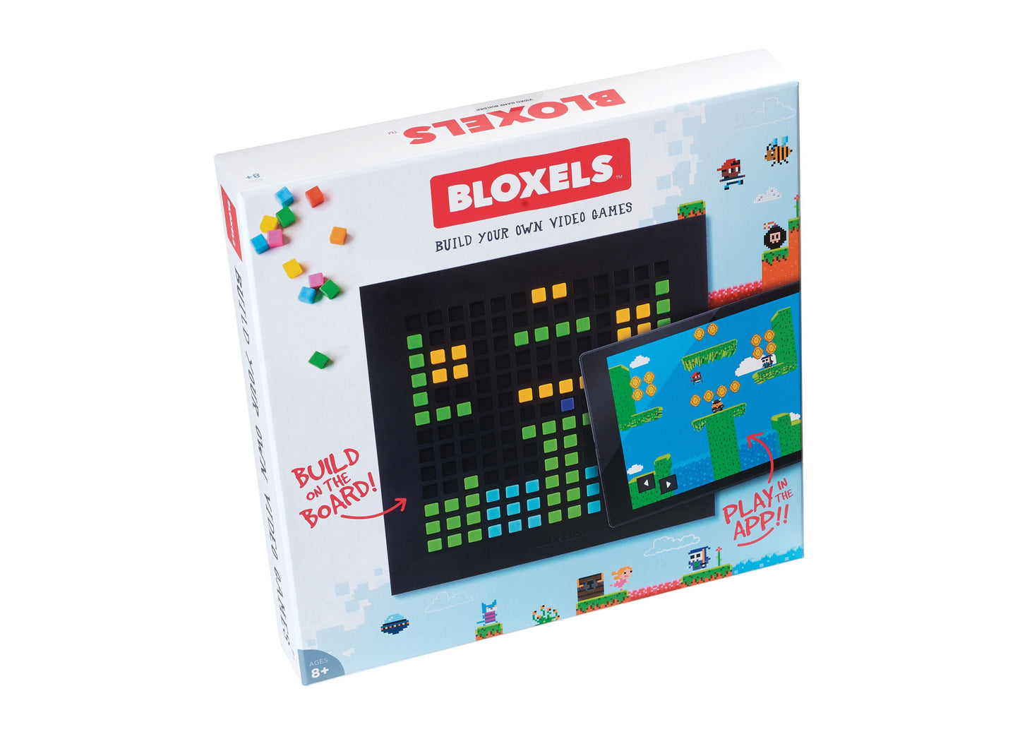 Bloxels Personal Edition box showing colorful plastic blocks, black board with green and yellow pixel blocks arranged on it, and tablet displaying pixel art vid