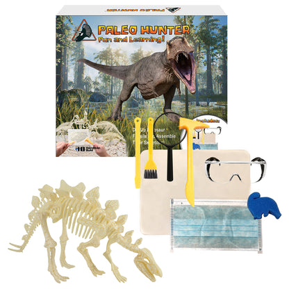 Paleo Hunter Fun and Learning kit contents displayed: dinosaur skeleton excavation box with fossil skeleton model, yellow and black digging tools, brush, magnif