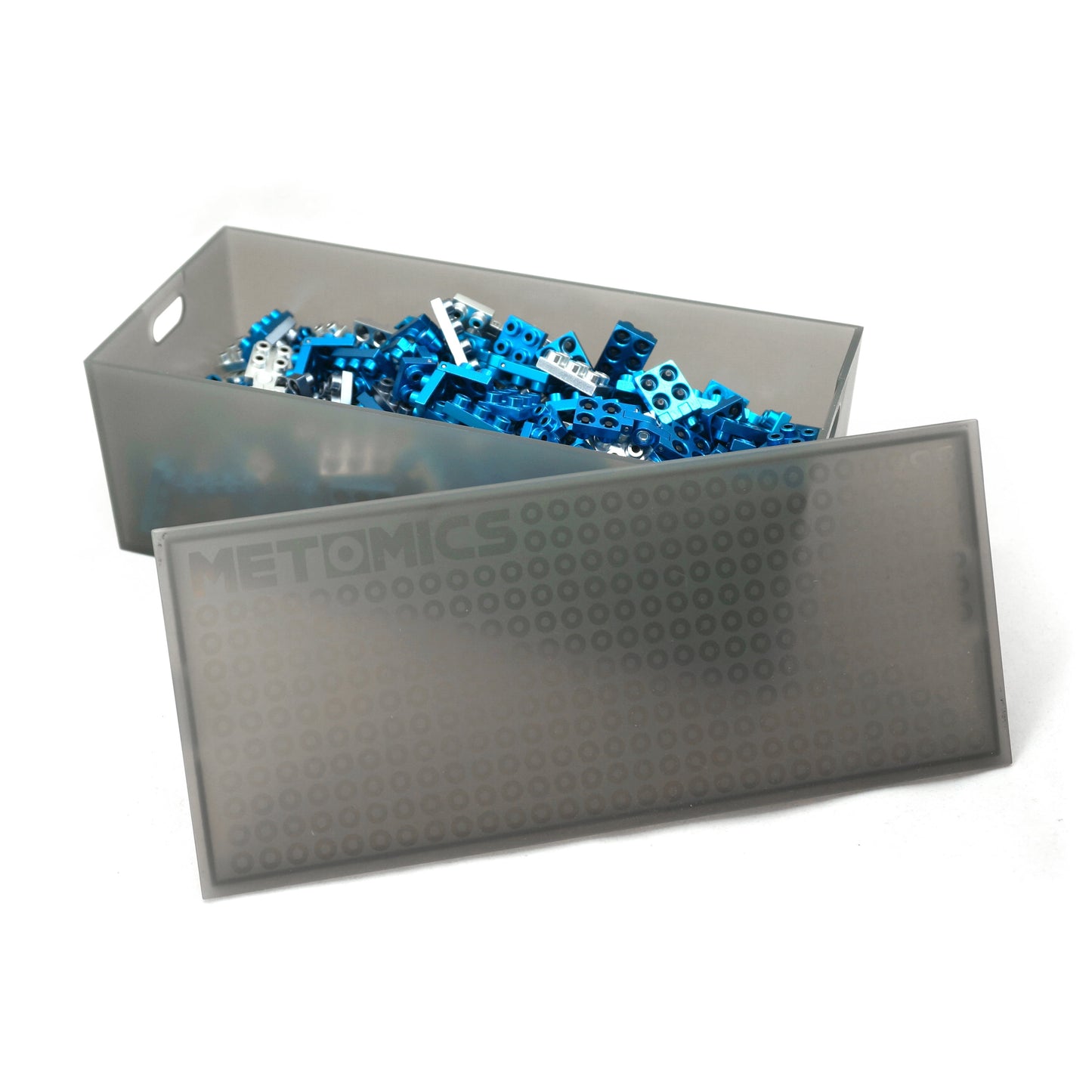 Metomics 3-in-1 Series 1 Collectible Builder Set in azure blue, gray storage container with lid open revealing blue building blocks and pieces