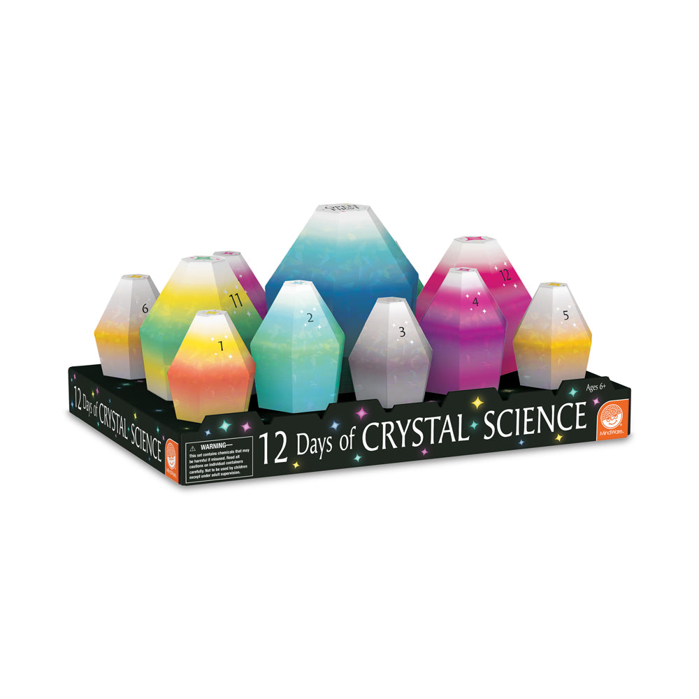 12 Days of Crystal Science kit displaying six colorful crystal-growing vessels with gradient colors including yellow, green, teal, pink, and magenta, numbered 1