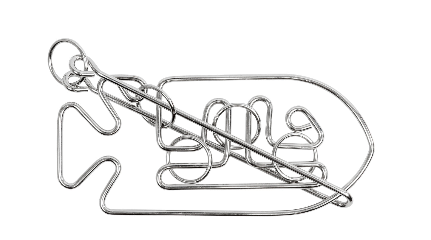 Silver metal wire puzzle shaped like a fish with interlocking loops and a sliding ring, shown on plain white background