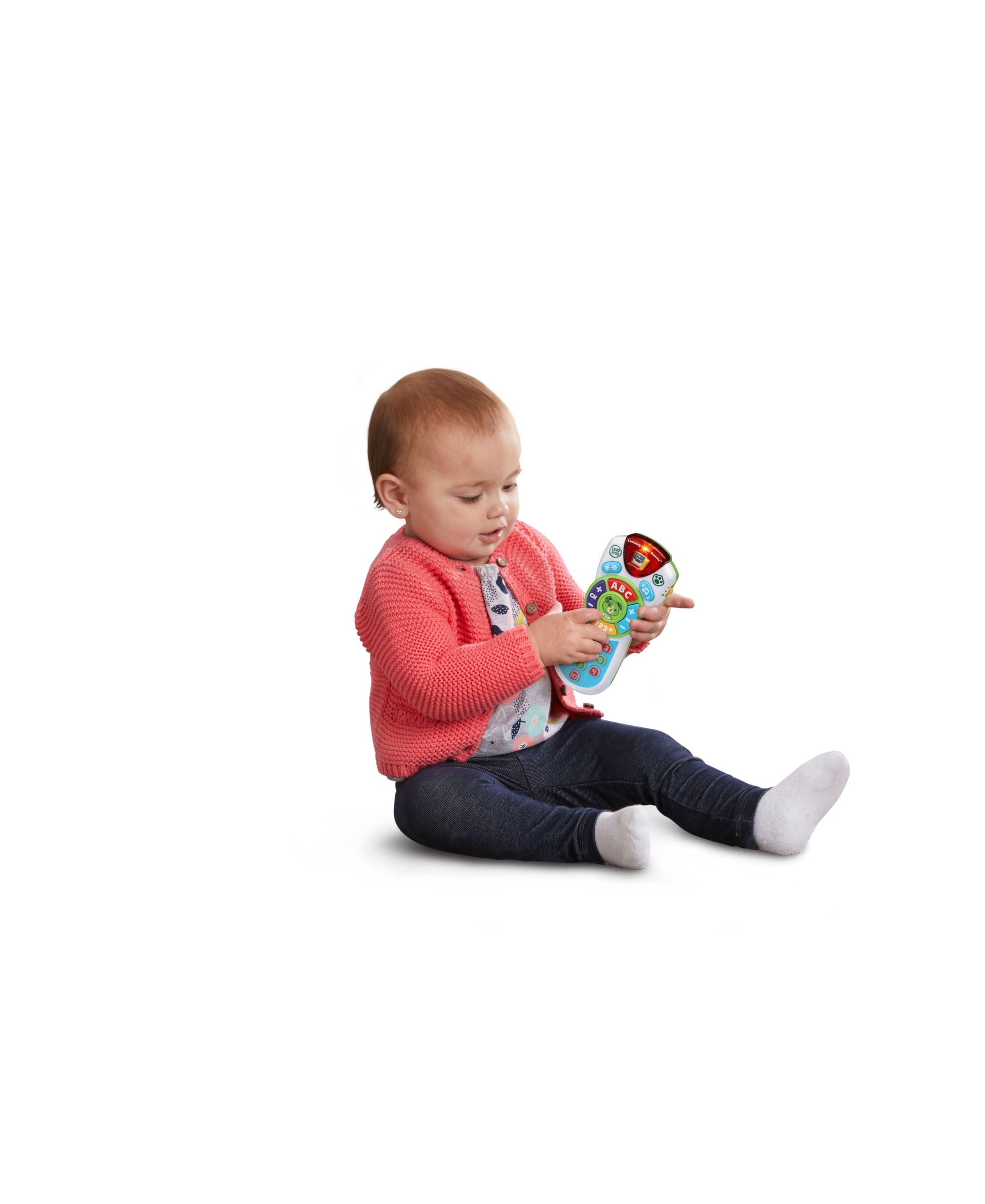 Baby playing with LeapFrog Scout's Learning Lights Remote in pink, blue, and colorful design
