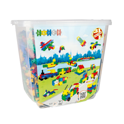 Clear plastic bucket of Clics colorful interlocking building blocks with illustrated lid showing constructed vehicles, buildings, and cityscape scene