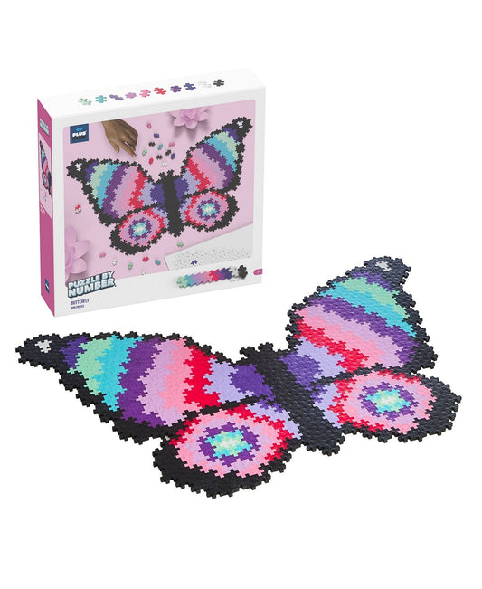 Plus-Plus Puzzle By Number Butterfly set showing pink box with colorful butterfly design and assembled 800-piece plastic puzzle pieces in black, purple, blue, p