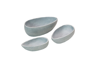 Set of three gray stone-textured oval bowls in graduated sizes on plain background
