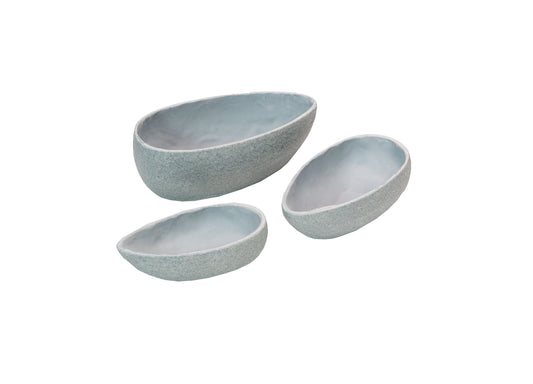 Set of three gray stone-textured oval bowls in graduated sizes on plain background