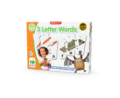 Match It! 3 Letter Words puzzle game box showing a child on model holding puzzle pieces, with word cards displaying letters n, r, u, g and illustrated pieces in