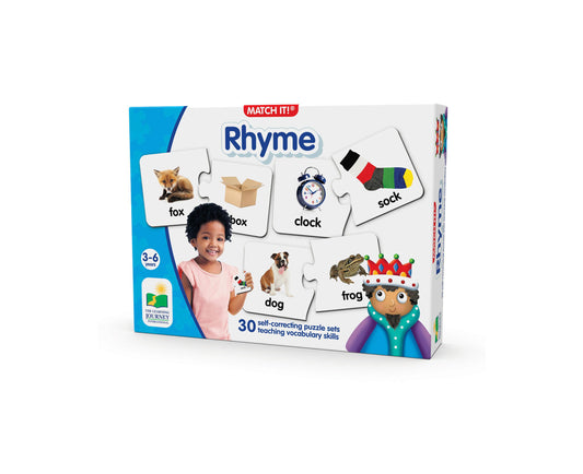 Match It! Rhyme puzzle game box showing a child modeled playing with cards featuring rhyming word pairs like fox/box, clock/sock, dog/frog. Includes 30 self-cor