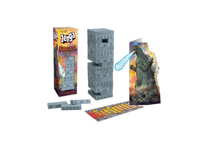 Jenga Godzilla Extreme Edition game set with stacked building blocks, Godzilla figure with light-up features, game board, and instruction cards on plain backgro