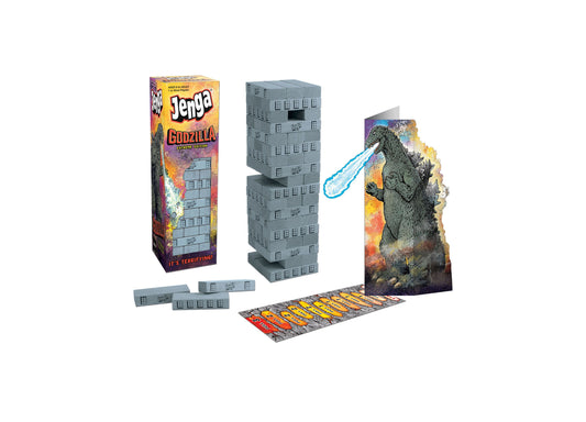 Jenga Godzilla Extreme Edition game set with stacked building blocks, Godzilla figure with light-up features, game board, and instruction cards on plain backgro