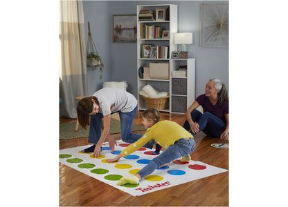Twister Game Classic with colorful red, yellow, blue, and green spots on mat, family playing together indoors