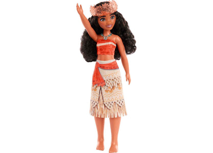 Disney Princess Moana fashion doll with black long wavy hair, pink feathered headpiece, red and white strapless top, and tan fringed skirt with geometric patter