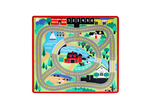 Colorful road rug with winding gray roads, yellow dashed center lines, houses, trees, water, and numbered storefronts at top, red border frame