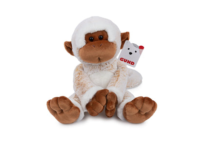 Gund Tilly The Monkey plush in cream and brown with white fuzzy hat and ears, sitting on plain background with attached tag