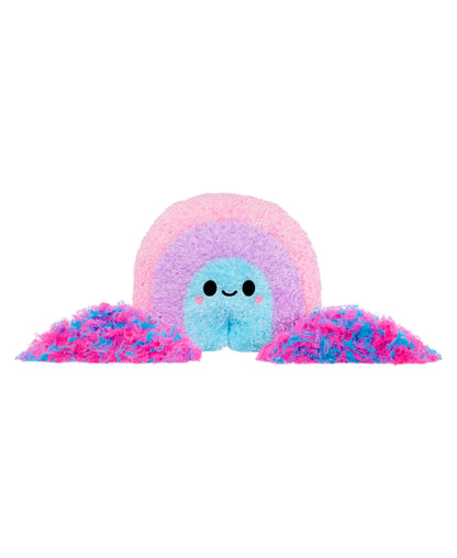 Fluffy pastel plush toy with blue center face, pink inner ring, purple middle ring, and pink outer layer, with two pink fuzzy pom-pom tentacles on either side