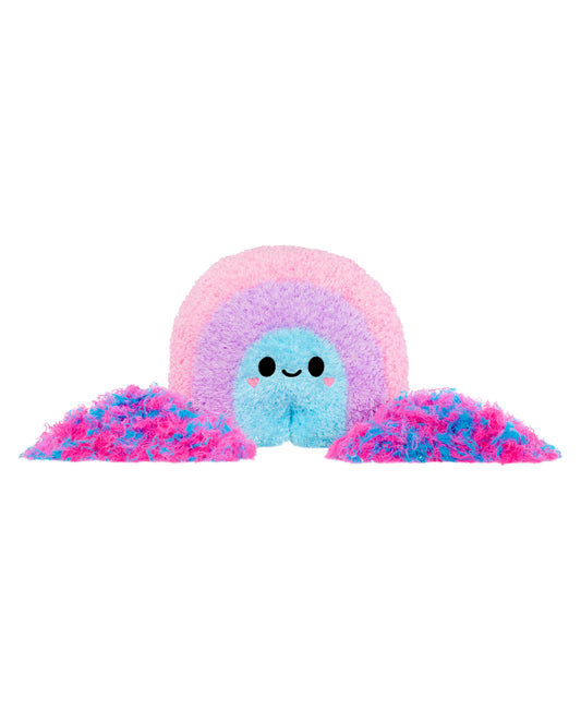 Fluffy pastel plush toy with blue center face, pink inner ring, purple middle ring, and pink outer layer, with two pink fuzzy pom-pom tentacles on either side