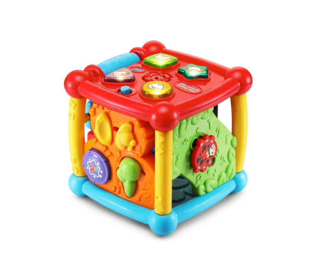 Colorful activity cube with red top panel featuring light-up buttons, yellow legs, blue base, and orange and green sides with interactive learning features