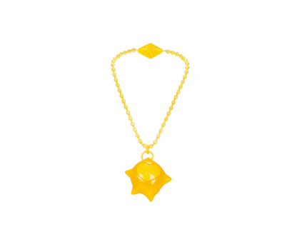 Yellow beaded necklace with diamond-shaped charm at top and four-pointed star pendant