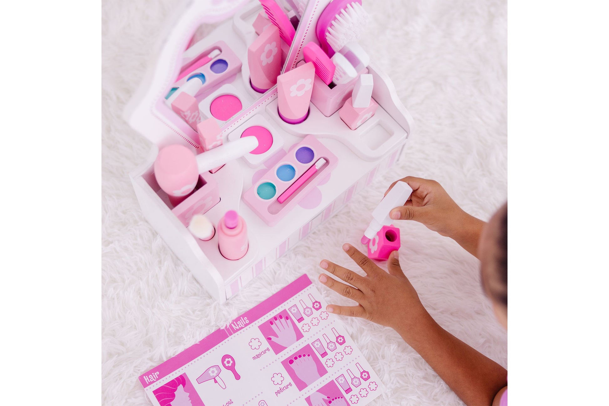Melissa & Doug Beauty Salon Play Set with pink accessories, brushes, and nail polish colors