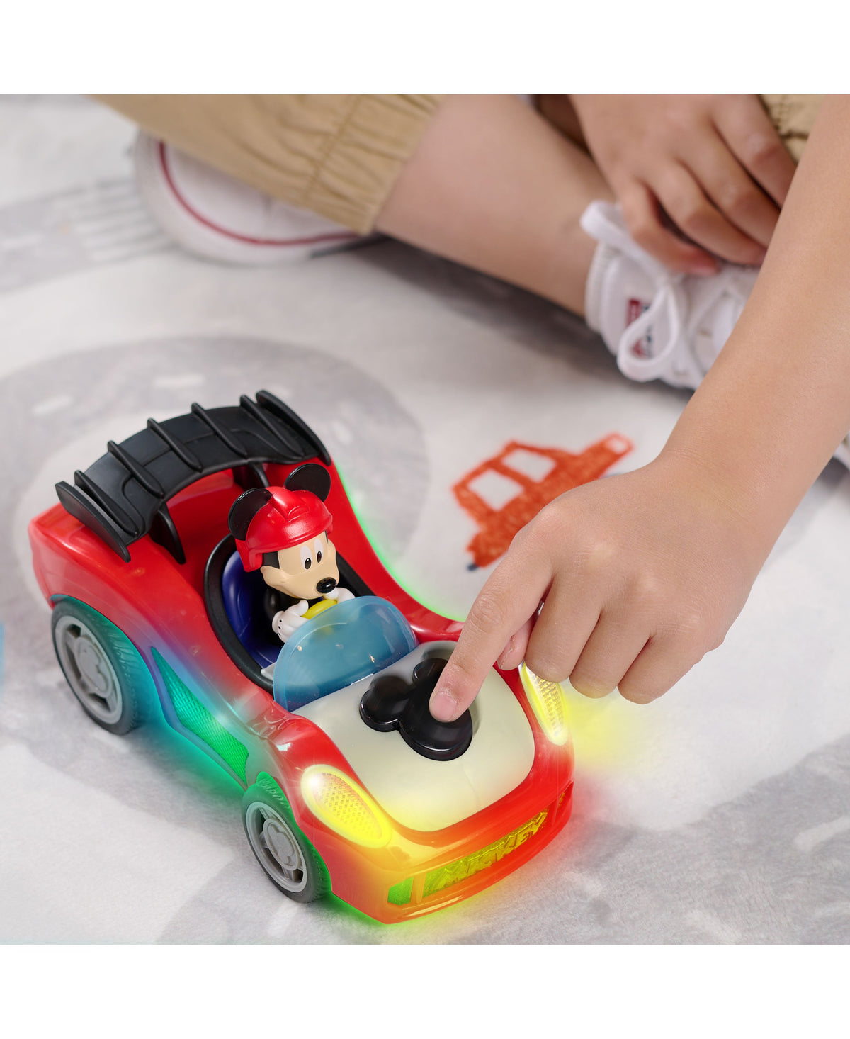 Mickey Mouse red race car toy with lights and sounds, featuring Mickey figure in driver's seat