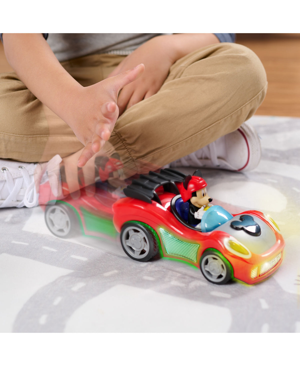 Mickey Mouse Rev 'N Go red race car with lights and sounds, featuring Mickey in driver's seat