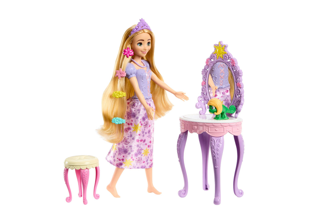 Disney Princess Rapunzel doll with long blonde hair wearing purple tiara and floral dress, shown with pink vanity stool and purple ornate vanity mirror with yel