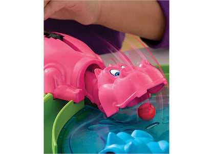 Hungry Hungry Hippos game with pink hippo figure and red marble on colorful board
