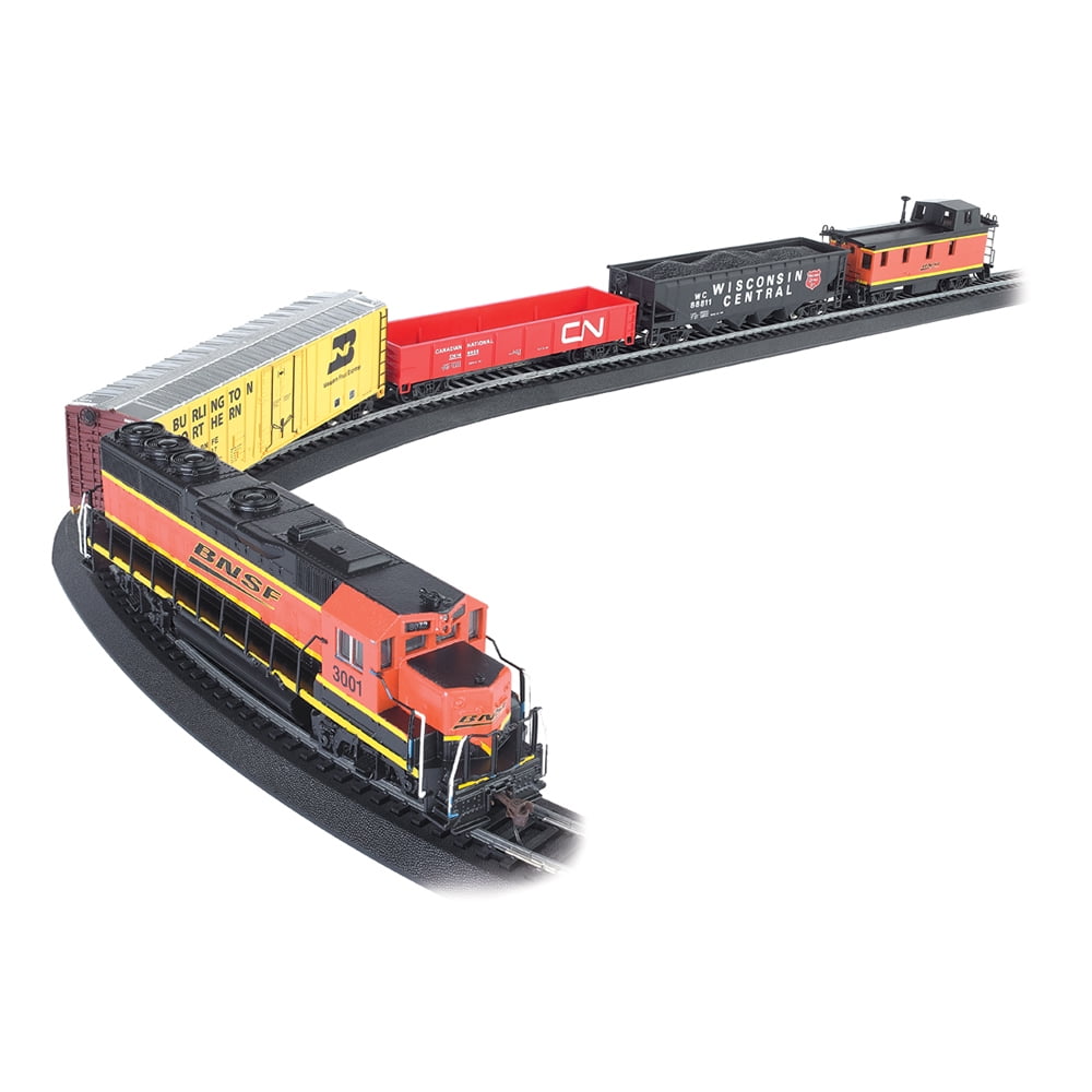 HO scale model train set with orange and yellow diesel locomotive, red freight car, black caboose, and yellow boxcar on curved black track