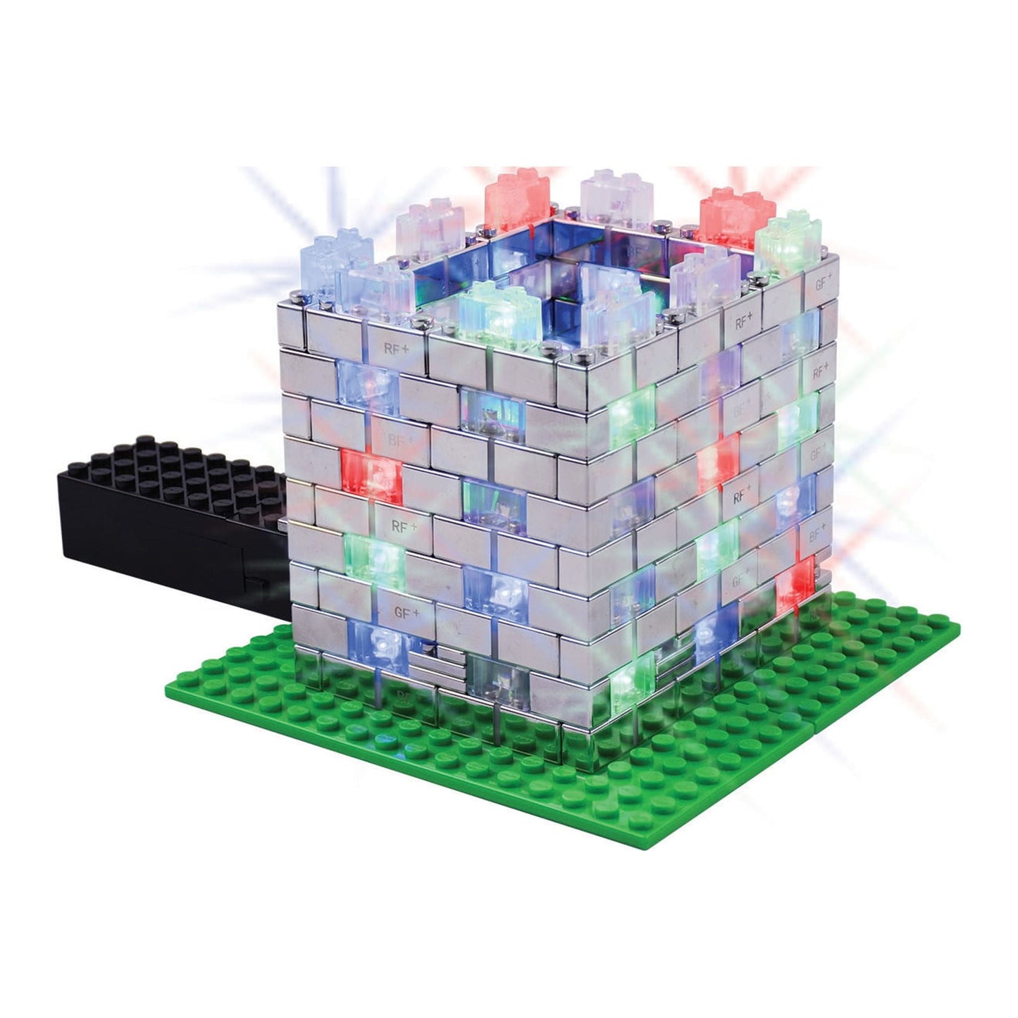 Power Blox Flashing Frenzy 135-piece LED building set with colorful light-up blocks stacked in a cube tower on green base plate, black base piece shown separate