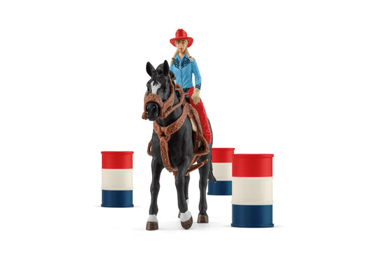 Cowgirl figure in blue shirt and red hat on black horse with brown saddle, positioned between two red-white-and-blue barrel obstacles