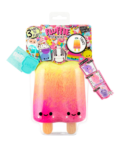 Fluffie Stuffiez popsicle plush with gradient yellow, orange, and pink fuzzy fabric, smiling face, wooden sticks, shown with colorful packaging and collectible