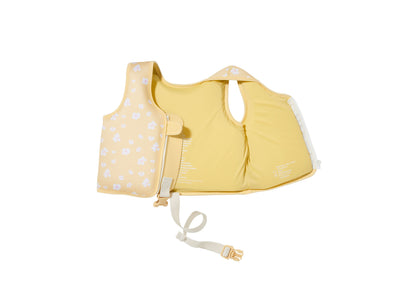 Sunnylife Kids Splash-Zone Neoprene Swim Vest for Ages 2-3 in yellow with white polka dot pattern, shown open to disp...