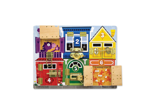 Wooden learning board with six colorful numbered houses featuring latches, locks, and doors. Purple pony house 1, blue train house 2, yellow house 3, red house